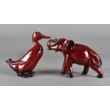 A Royal Doulton flambé figure, elephant, together with a flambé duck (2)