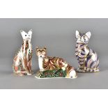 Royal Crown Derby, three paperweights, fox cub and two pussy cats, all with stoppers (3)