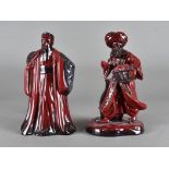 A Royal Doulton flambé figure, The Lamp Seller, HN 3278, together with Confucius, HN 3314 (2)