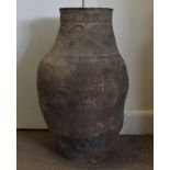A large terracotta ovoid oil jar, with sgraffito decoration to neck, 71 cm high