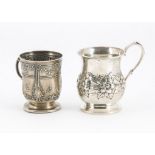 Two early 20th Century silver Christening tankards, one Edwardian with raised flower designs from