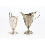 Two Victorian silver cream or milk jugs, one helmet shaped by Charles Boyton, the other facet helmet