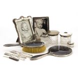 A collection of Victorian and later silver and other dressing table items, including two