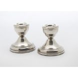 An Art Deco silver filled capstan inkwell, together with a pair of 1970s silver filled dwarf