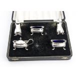 A 1970s silver five piece cruet set, in fitted box, lacks spoons