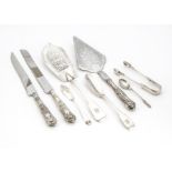 Eight Victorian and later silver and silver serving items, including a Victorian silver fish slice