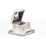 A late Victorian glass desk inkwell from Mappin Bros, square form with hinged cover, glass liner,