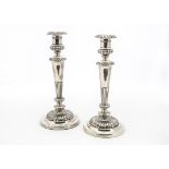 A pair of large George III silver filled candlesticks by John Roberts & Co, circular spreading bases