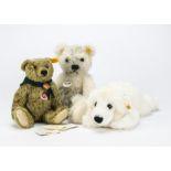 Three Steiff yellow tagged teddy bears: Chris - 12in. (30cm.) high, a 1920s teddy bear celebrating