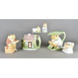 A collection of toad and frog related items, teapot, money box, large jug, egg cup, milk jug and