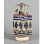 A West African beadwork cylindrical box, the body with all over bands decorated with face and