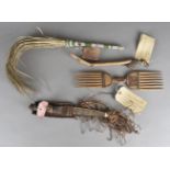 A Nigerian beadwork fly swish, an African knife, hair comb and spoon