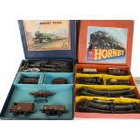 Hornby O Gauge Post-war Clockwork Goods Train Sets, including a LMS no 601 set with matt crimson 0-