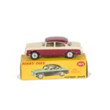 A Dinky Toys 165 Humber Hawk, maroon lower body and roof, cream upper body, spun hubs, in original