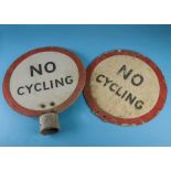 Two vintage circular 'No Cycling' road signs, one with a post fitting collar, 45cm diameter (2)