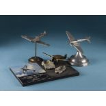 A 1950s aluminium Spitfire desk decoration, together with a board with Johnnie Johnson book