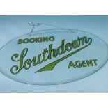 A vintage oval glass travel agents Southdown Bus advertising sign, printed to reverse with Booking