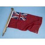 A small Jackstaff with "Red Duster" c1930s; of varnished mahogany staff and traditional red-ensign