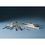 A collection of diecast waterline models of ships and boats, in two K-Bins, including naval,