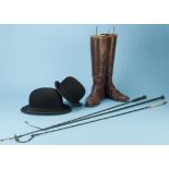 A pair of brown Leather riding boots, with wooden tree stretcher inserts, two bowler hats (Adams