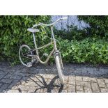 A vintage Raleigh Gresham Flyer child's bicycle, in gold colour, with white saddle and tyres