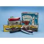 A group of four Tri-ang plastic boats, including no.491S clockwork Motor Lifeboat, in box, a