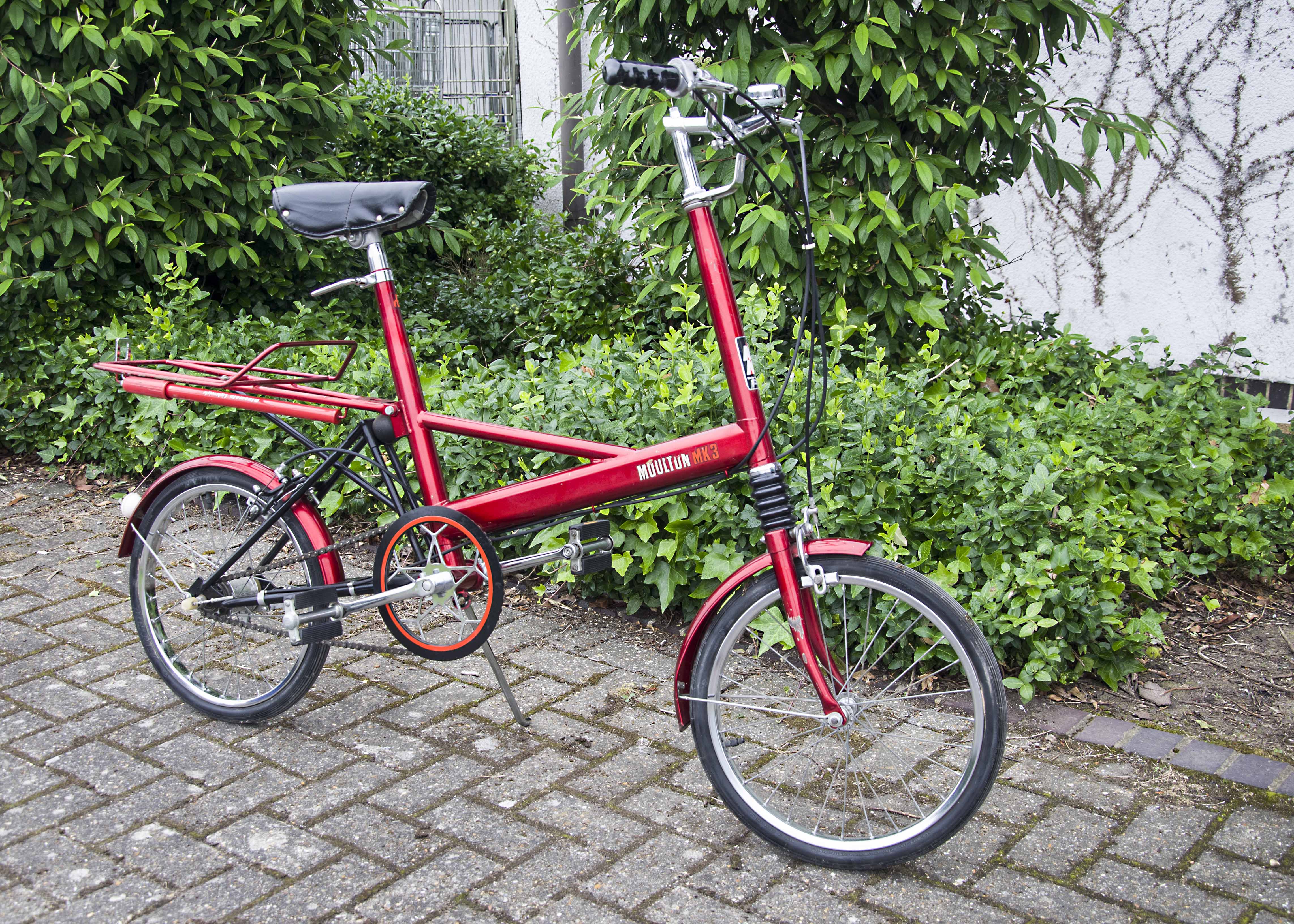 An early 1970s Moulton Mark 3 bicycle, in red, in very good working order and condition, some