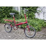 An early 1970s Moulton Mark 3 bicycle, in red, in very good working order and condition, some