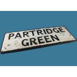 A vintage town road sign, "Partridge Green", pressed aluminium with raised lettering and border,