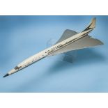 A vintage fibreglass model of Concorde, in "Air France" livery, possibly a travel agents model, some