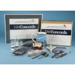 A collection of Concorde memorabilia, including two signed flight certificates, large mug,