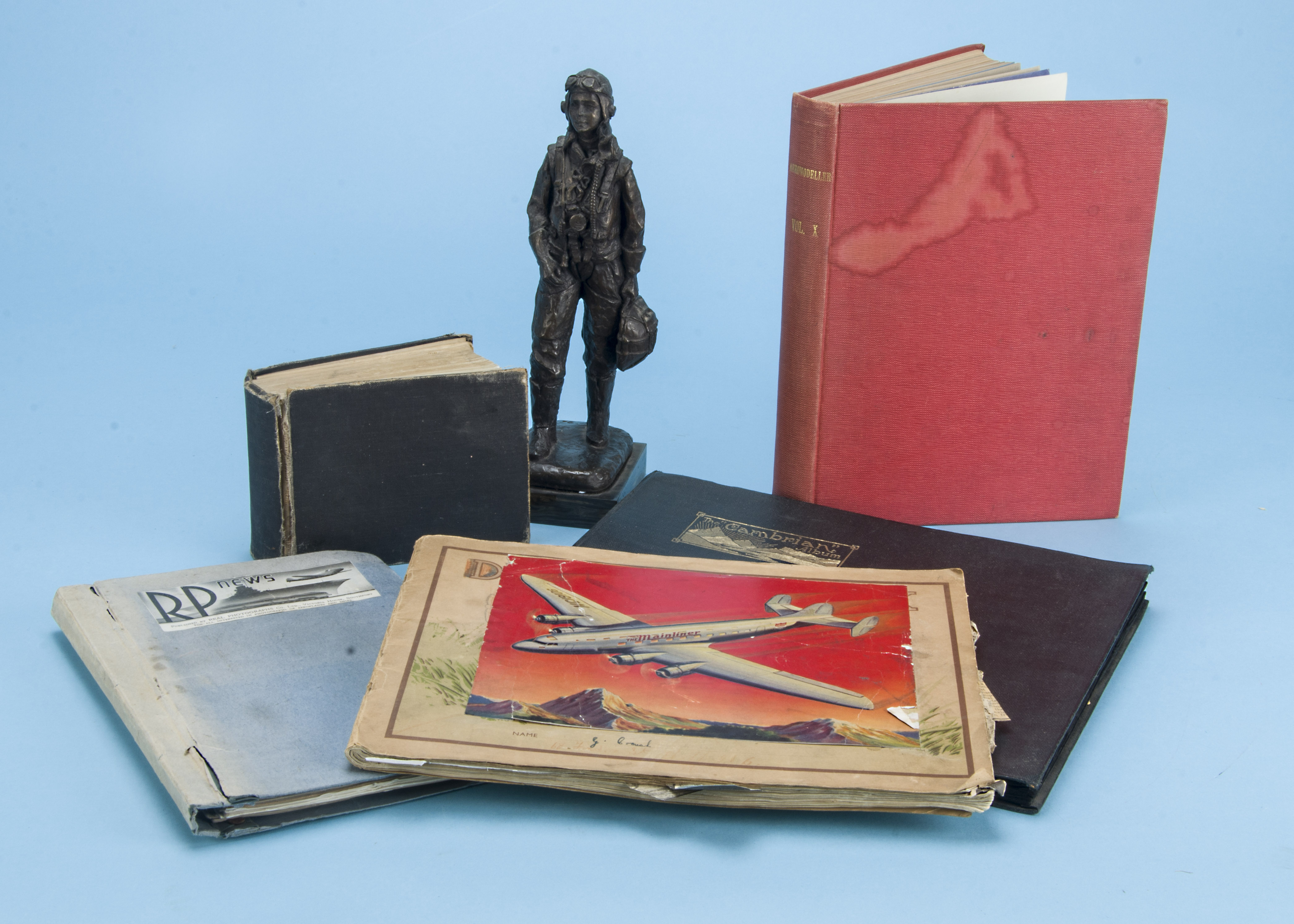 A vintage album containing WWII and other aircraft, mostly RP postcards in a black album, together