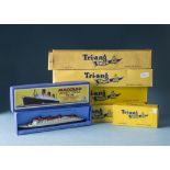 Four Tri-ang waterline models of ocean liners, 1:1200 scale, in yellow boxes, with two Queen