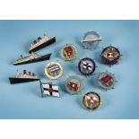 A collection of twelve cruise liner and other shipping enamel badges, including a Queen Elizabeth