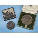 A vintage Royal Mint bronze RMS Queen Mary medallion in case, together with an RMS Lusitania