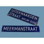 Two vintage Dutch street signs, blue and white and stating "Meermanstraat" and "Uiterwaardenstraat