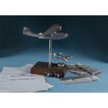 Two vintage aluminium models of desk aircraft, one larger naïve aeroplane of a US Navy PBY Catalina,