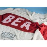 A vintage cotton BEA terminal flag, 272cm wide, together with a smaller terminal flag with red and