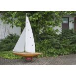 An large Art Deco style remote control pond yacht, "Helene", having wooden hull and decking, with