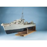 A vintage scratchbuilt remote control model of a battleship or destroyer, black and grey, deck