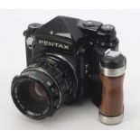 A Asahi Pentax 6X7 SLR Camera, serial no. 4195677, black, metered prism, shutter fires, body, F-G,