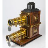 A Fine Mahogany cased, Biunial Magic Lantern believed to have been manufactured by Wrench & Sons,