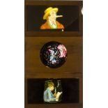 Twelve Lithographic Mahogany-Mounted and Framed Magic Lantern Slides, one a rackwork slide of a