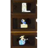 Eight Mahogany-Framed Hand-Coloured Magic Lantern Slipping Slides, of a highwayman, a man and a pig,