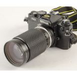 A Nikon FM2 SLR Camera, serial no. 7397540, black, VG, shutter working, with Zoom-Nikkor 35-135mm