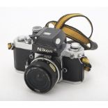 A Nikon F2 Photomic SLR Camera, serial no. 7460376, chrome, shutter working, body, G-VG, light marks