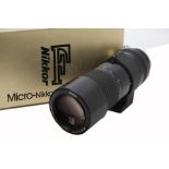 A Nikon Micro-Nikkor 200mm f/4 Lens, serial no. 178394, AI, black, barrel, VG, elements, VG, light