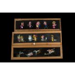 Twelve Mahogany-Mounted Hand-Painted Long Magic Lantern Slides, Each with comic figures and approx