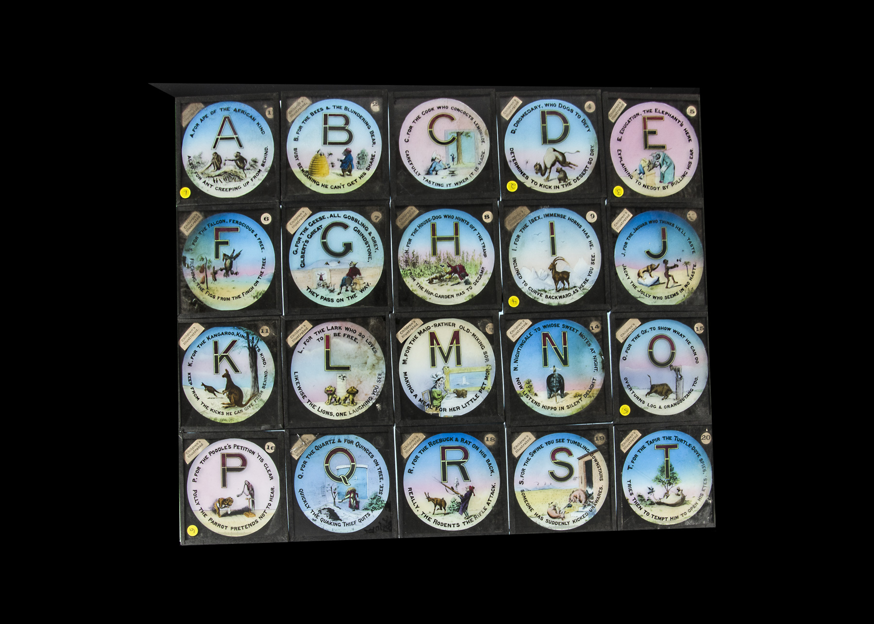 Alphabet Magic Lantern Slides, 26 coloured slides, A-Z with captions and comic images on each with