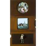 Nine Mahogany-Framed Hand-Coloured Magic Lantern Slipping Slides, one a double glass slipping